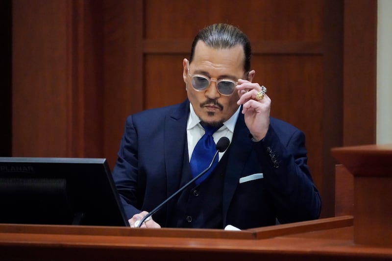 US actor Johnny Depp takes a seat to give evidence in the courtroom in Fairfax, Virginia, in April. EPA