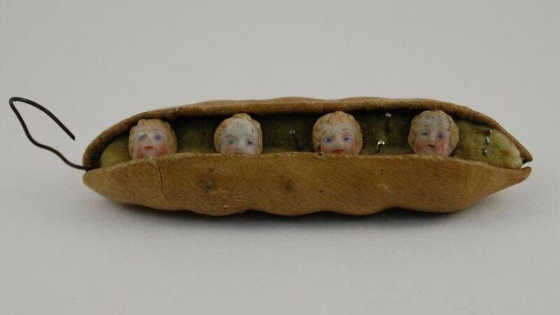 A pincushion with tiny children's heads embedded in them from the Norwich Castle museum. Via @RedHeadedAli / Twitter 