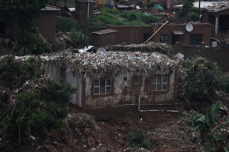 Flood debris covers the roof of a house. EPA