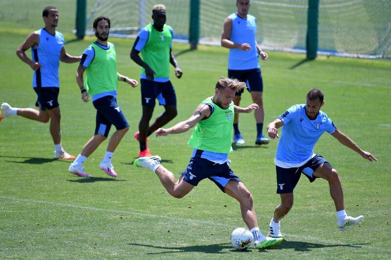 Lazio's Ciro Immobile and Stefan Radu during training. Getty