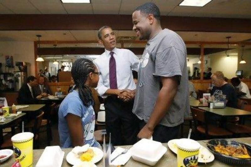 US president Barack Obama greets diners during a campaign stop at a Cincinnati restaurant. In 2008 he secured 95 per cent of the black vote and made history.