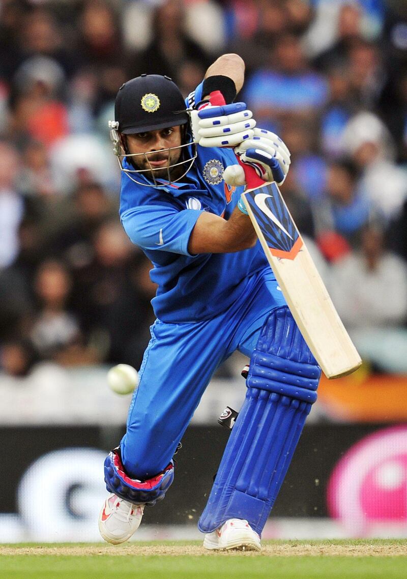 India's Virat Kohli plays a shot during the 2013 ICC Champions Trophy One Day International (ODI) cricket match between India and West Indies at The Oval in London, England on June 11, 2013.   India are chasing West Indies innings score of 233 runs for the loss of nine wickets after India won the toss and elected to field first.  AFP PHOTO/GLYN KIRK - RESTRICTED TO EDITORIAL USE
 *** Local Caption ***  318431-01-08.jpg