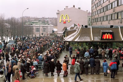 Customers stand outside the newly-opened, first McDonald's in the Soviet Union, at Moscow's Pushkin Square, in January 1990. AFP