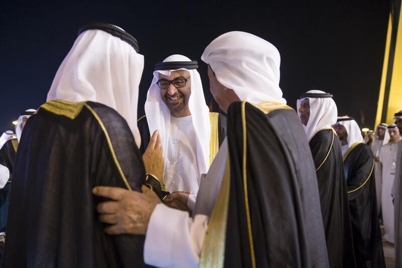 Sheikh Mohammed bin Zayed, Crown Prince of Abu Dhabi Deputy Supreme Commander of the UAE Armed Forces (C), Sheikh Hamad bin Mohammed, Ruler of Fujairah (L) and Sheikh Humaid bin Rashid, Ruler of Ajman (R) attend the 44th UAE National Day celebrations at Zayed Sports City. Mohamed Al Hammadi / Crown Prince Court - Abu Dhabi
