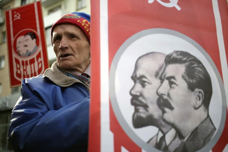 Russians in Simferopol, Crimea, commemmorate the 98th anniversary of the Bolshevik Revolution with portraits of Soviet Union founder Vladimir Lenin and leader Joseph Stalin, in November. Max Vetrov / AFP.