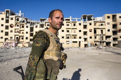 RAQQA, SYRIA - AUGUST 19:  British volunteer fighter 'Macer Gifford' on August 19, 2017 in Raqqa, Syria. Five years ago 'Macer Gifford' (as he likes to be known) was working in London for The Foreign Exchange. He is a 30-year-old, self-confessed 'country-bumpkin' from Cambridgeshire, England. When he saw the atrocities that were happening throughout Iraq and Syria under the banner of the so called Islamic State (ISIL) Macer thought enough was enough. In 2013 he attended a one-week military training course with the Kurdish militia in the mountains of Kurdistan and is now fighting as a sniper with the Syriac Military Council (MFS) . The MFS is a group of Assyrian Christians who fight alongside the Syrian Democratic Forces (SDF) in Raqqa. The SDF was created in 2015 with the specific purpose of fighting ISIL and was armed by former US President Obama. The second Battle of Raqqa was launched in June 2017 and is the fifth and final phase of the Raqqa Campaign by the SDF.  (Photo by Rick Findler/Getty Images)