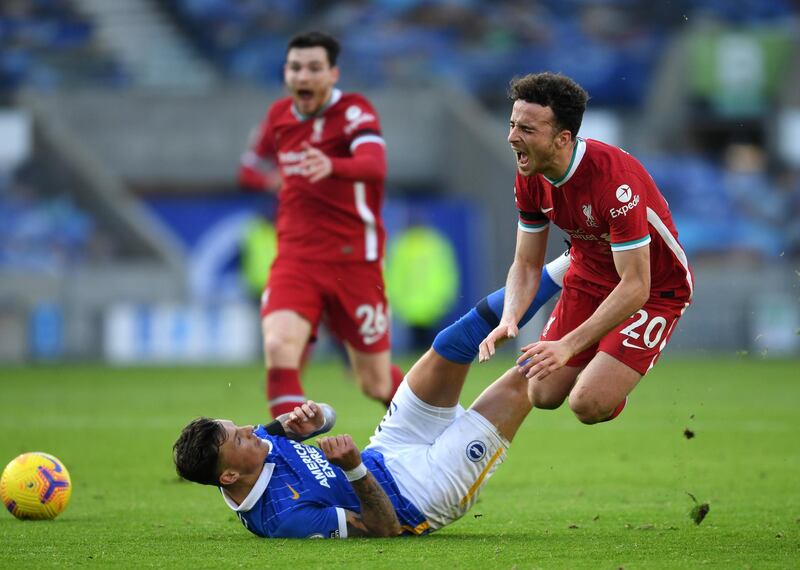 Liverpool's Diogo Jota is fouled by Ben White of Brighton. Getty