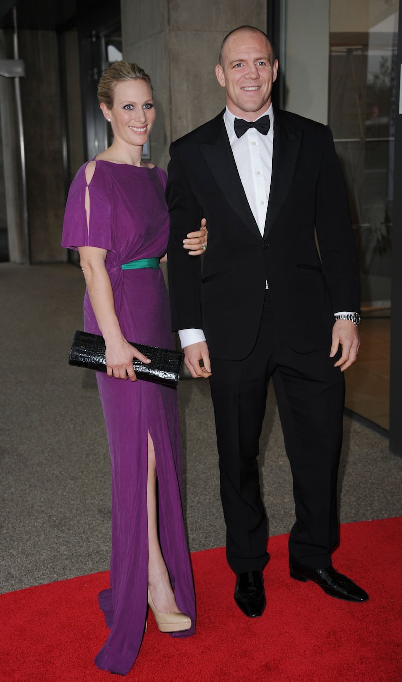 Zara Tindall, wearing a purple gown with a green belt, and Mike Tindall attend the Rugby For Heroes Charity Gala Dinner at Twickenham Stadium on May 9, 2012. Getty Images