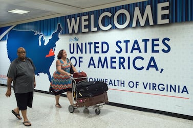 Travellers arrive at the Dulles International Airport outside Washington, in Dulles, Virginia. AFP