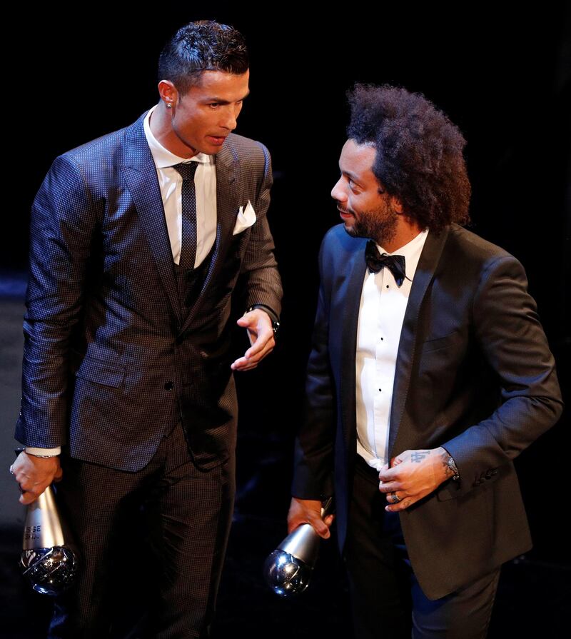 Real Madrid’s Cristiano Ronaldo speaks with Real Madrid’s Marcelo after winning The Best Fifa Men’s Player Award . John Sibley / Reuters