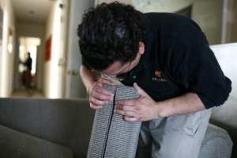 SAN FRANCISCO - APRIL 30: Pestec technician Carlos I. Agurto inspects a couch cushion for bed bugs at an apartment with bed bugs April 30, 2009 in San Francisco, California. Cases of bed bug infestations are on the rise across the U.S. with many people bringing them into their homes after visiting hotels and airports. Bed bugs feed off of human blood.   Justin Sullivan/Getty Images/AFP