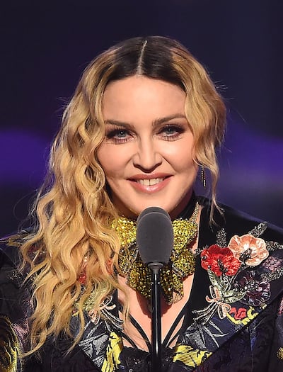 NEW YORK, NY - DECEMBER 09: Madonna speaks on stage at the Billboard Women in Music 2016 event on December 9, 2016 in New York City.   Nicholas Hunt/Getty Images for Billboard Magazine/AFP