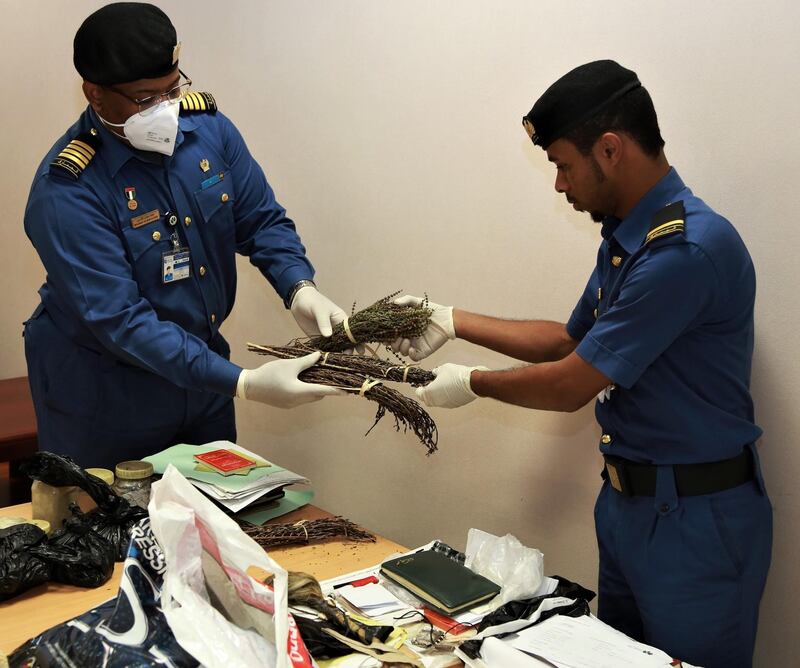 Dubai Customs officers seized animal hair, bones and drawings, pieces of metal, rings and books of magic techniques.