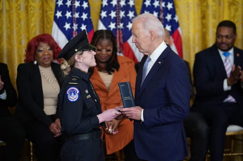Mr Biden awards the Presidential Citizens Medal to US Capitol Police Officer Caroline Edwards. AFP