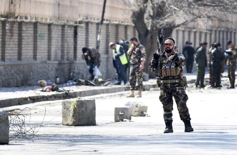 epaselect epa06617171 Afghan security officials inspect the scene of a suicide bomb blast that targeted a shrine visited by Shi'ite Muslims as the country observes the Nowruz Persian New Year, in Kabul, Afghanistan, 21 March 2018. According to media reports at least 26 people were killed in the incident. Kabul authorities overhauled the security plan of the city after the attack, establishing a new system to prevent large-scale attacks.  EPA/HEDAYATULLAH AMID