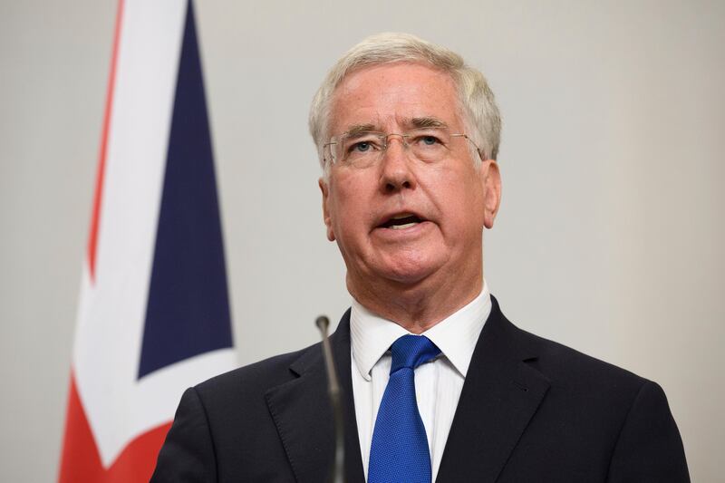 Britain's Defence Secretary, Michael Fallon, addresses members of the media during a joint UK/Poland press conference in the Foreign and Commonwealth Office Thursday, Oct. 12, 2017 in London. The UK and Poland held bilateral talks in Westminster, covering issues such as European security and military co-operation. (Leon Neal/Pool Photo via AP)