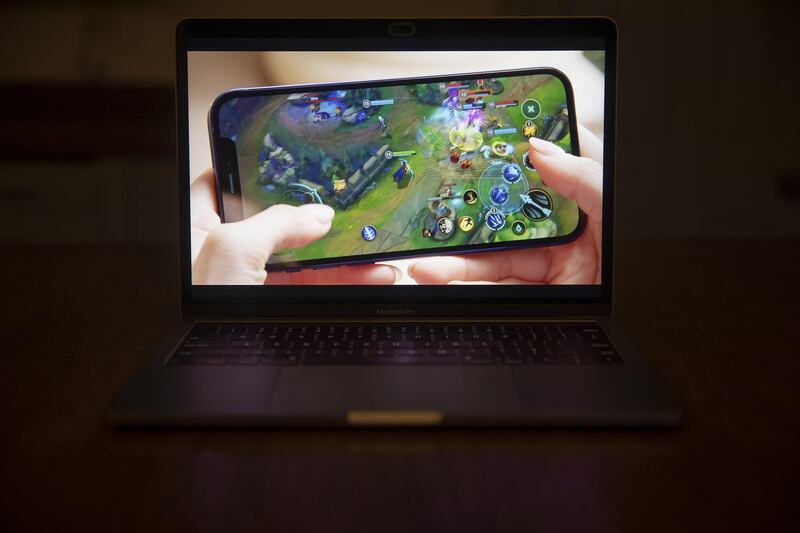 The League of Legends Wild Rift game is displayed on a Apple iPhone 12 during a virtual product launch.  Bloomberg