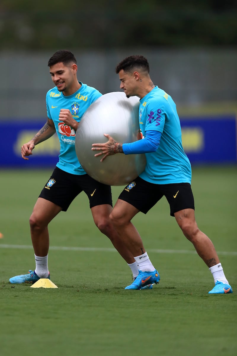 Bruno Guimarees, left, and Philippe Coutinho train at the Granja Comary training complex. Getty