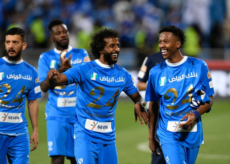 Al Hilal's Yasser Al-Shahrani celebrates with teammates . Reuters