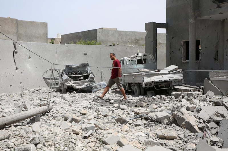 A local walks as he checks his destroyed house after an airstrike launched by Khalifa Haftar forces in the Tajoura area, east of Tripoli, Libya.  Reuters