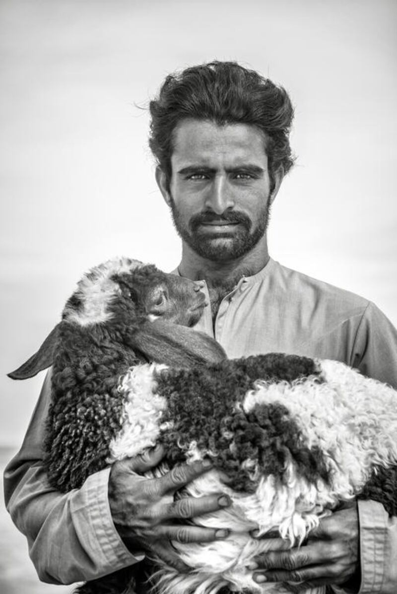 A farmer with a goat during Al Dhafra Festival in Abu Dhabi. Courtesy Yiannis Roussakis