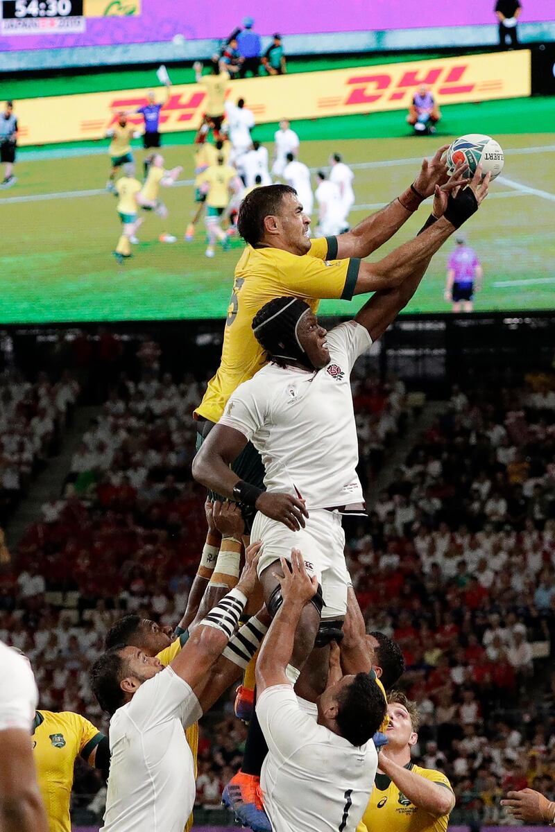 Australia's Rory Arnold and England's Maro Itoje compete for the lineout ball during the Rugby World Cup quarterfinal match at Oita Stadium between England and Australia in Oita, Japan. AP Photo
