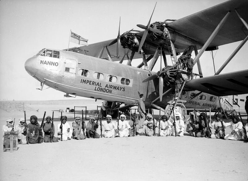 The Imperial Airways Hannibal Class Handley Page HP42 passenger plane Hanno, surrounded by an armed guard provided by the Sheikh of Sharjah during a refuelling stop at Kuwait. Photo by Fox Photos/Getty Images
