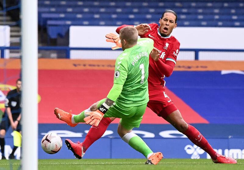 Liverpool's Virgil van Dijk is injured by Jordan Pickford in the Merseyside derby. PA