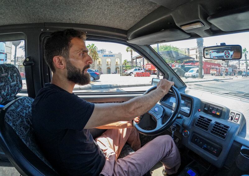 Ahmad Al Safadi drives his car, modified to run on solar power, in the port city of Sidon, Lebanon. Photo: Reuters