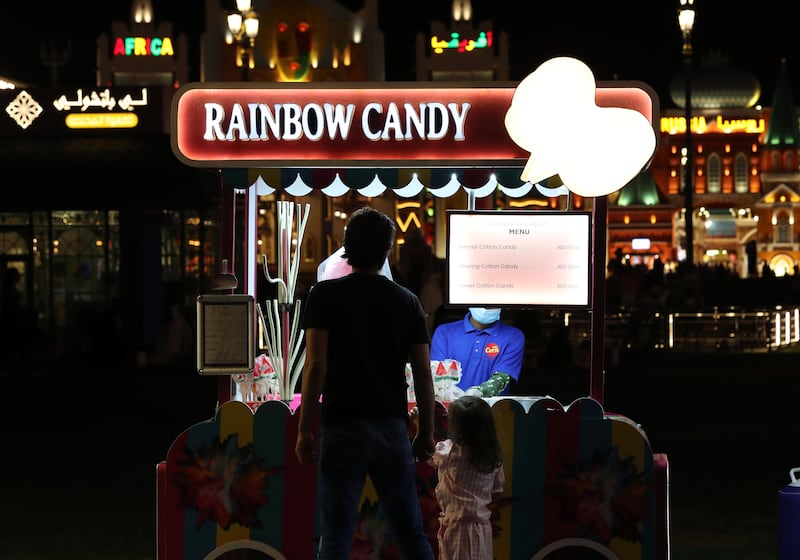 Visitors buy Rainbow candy