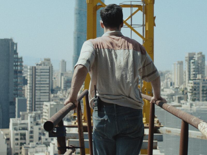 'Warsha' follows a construction worker as he works on a crane in Beirut, overlooking the city from a dizzying and dangerous height. Photo: Dania Bdeir