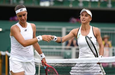 Lesia Tsurenko, right, of Ukraine celebrates beating compatriot Anhelina Kalinina. PA