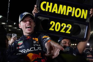 Red Bull driver Max Verstappen of the Netherlands celebrates with teammates as he became F1 drivers world champion, during the Japanese Formula One Grand Prix at the Suzuka Circuit in Suzuka, central Japan, Sunday, Oct.  9, 2022.  (AP Photo / Toru Hanai)