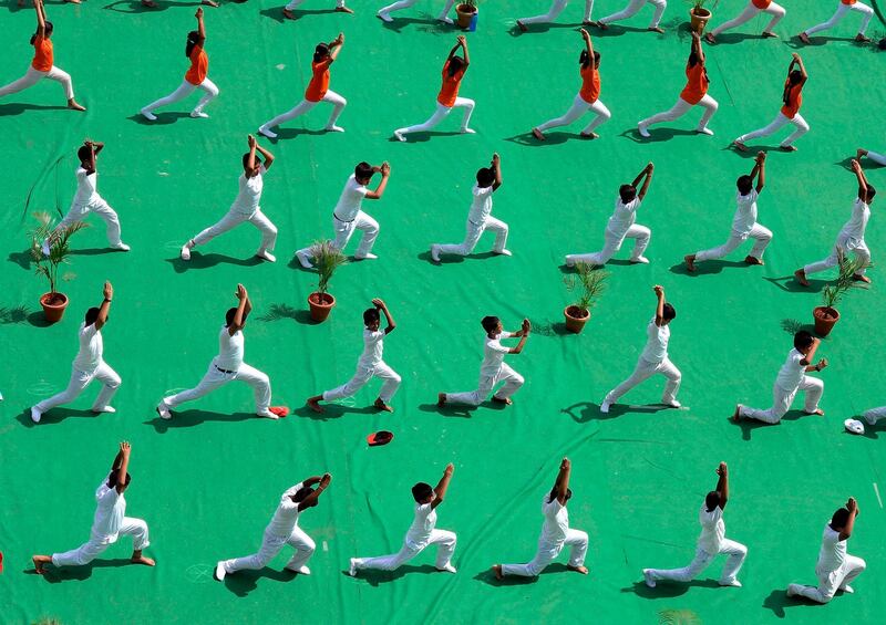 Indian pupils perform yoga ahead of International Yoga Day in Hyderabad.  AFP