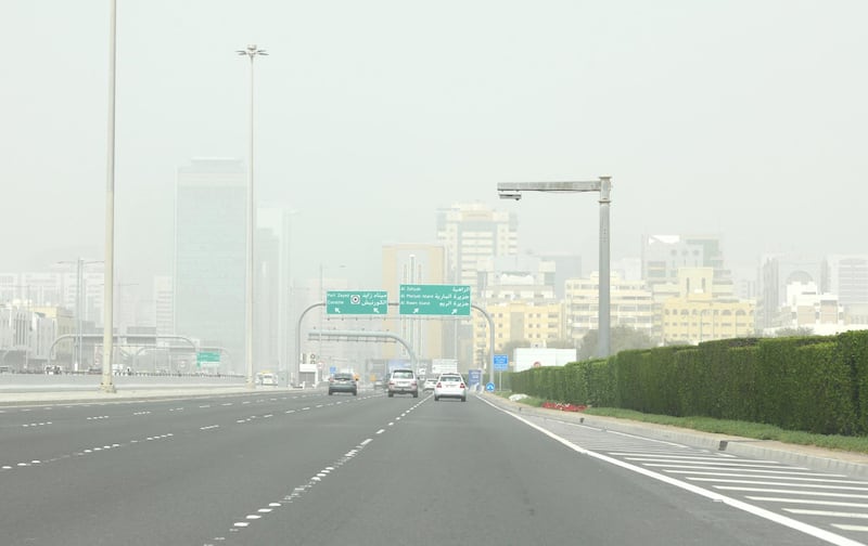 Abu Dhabi, United Arab Emirates - Poor visibility in the city of Abu Dhabi. Khushnum Bhandari for The National