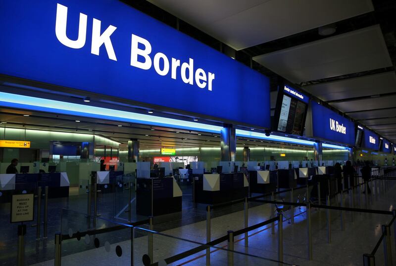 FILE PHOTO: UK Border control is seen in Terminal 2 at Heathrow Airport in London June 4, 2014. REUTERS/Neil Hall/File Photo