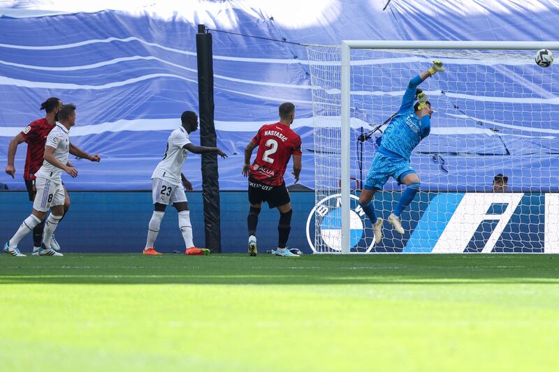 Mallorca's Vedat Muriqi scores past Real Madrid goalkeeper Thibaut Courtois. AFP