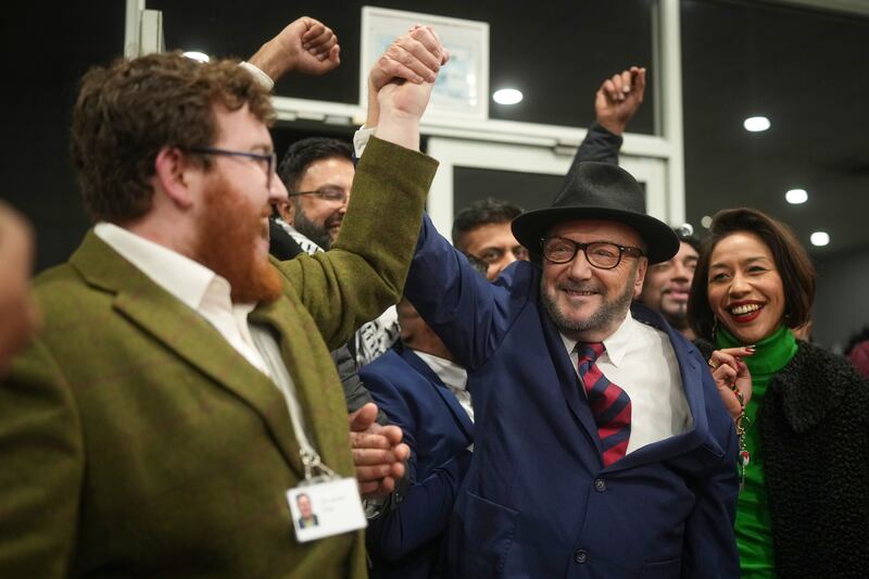 George Galloway celebrates with supporters after being declared the winner of the Rochdale by-election. Getty Images