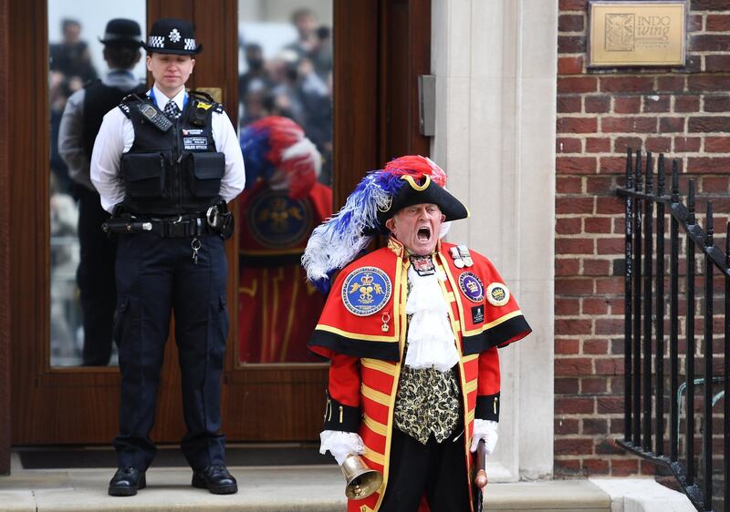 A traditional town crier announces the birth of a baby boy outside the Lindo Wing of St. Mary's hospital in London, Britain, 23 April 2018. (EPA/ANDY RAIN)