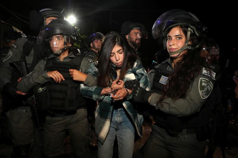 Israeli police detain a Palestinian woman protester amid ongoing tension ahead of an upcoming court hearing in an Israel-Palestinian land-ownership dispute in the Sheikh Jarrah neighbourhood of East Jerusalem. Reuters