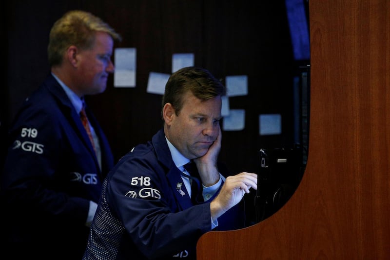 Traders work on the floor of the New York Stock Exchange (NYSE) in New York, U.S., June 19, 2018. REUTERS/Brendan McDermid