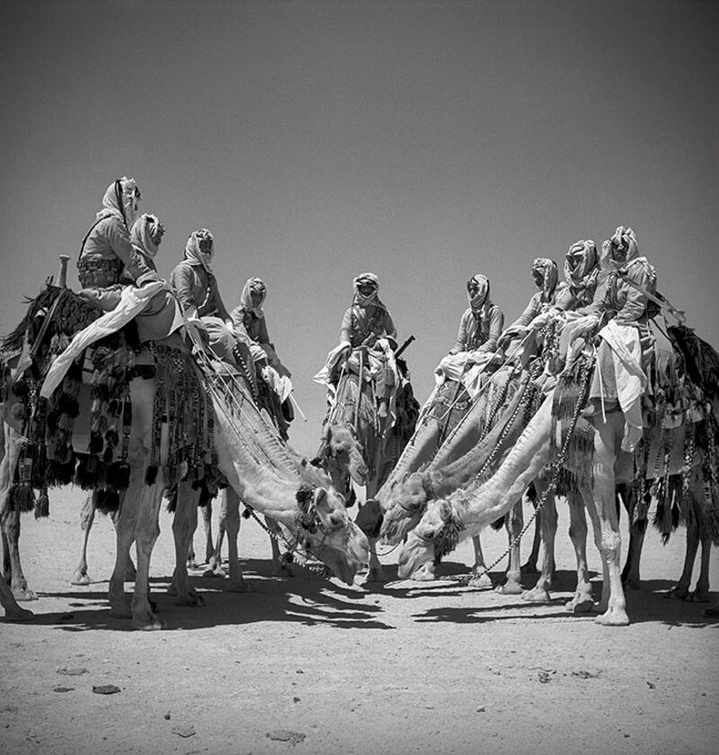 Soldiers from the desert patrol on their camels about 100 km from Amman, Transjordan, Fort Mafrak, 1941.  Photo: George Rodger