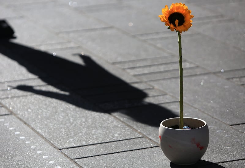 Ukraine's national flower, the sunflower, placed amid a crowd in Times Square. Getty Images