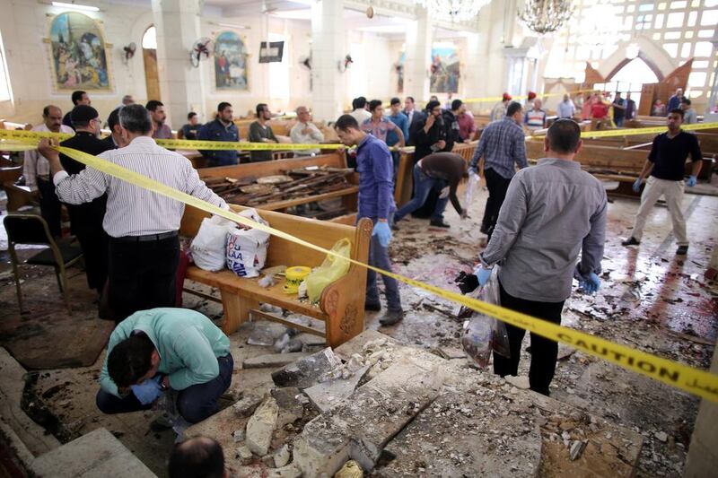 Security personnel investigate the scene of the bombing at the Mar Girgis church in Tanta, 90 kilometres north of Cairo, on April 9, 2017. Khaled Elfiqi / EPA