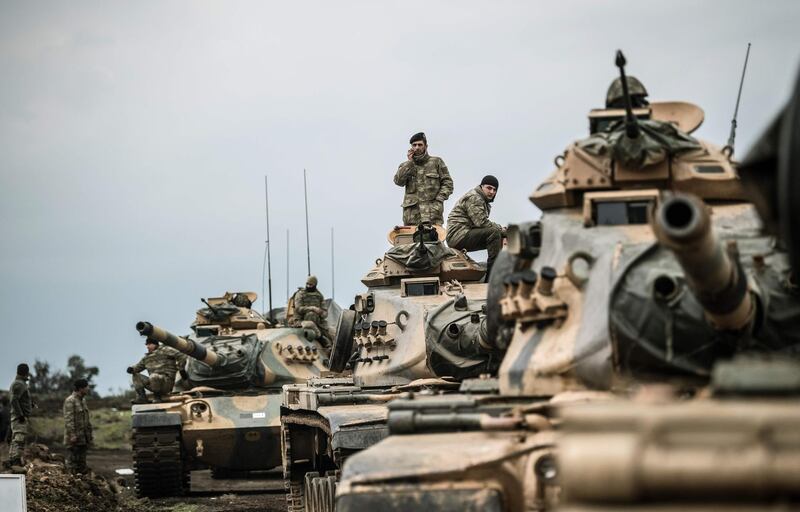 TOPSHOT - Turkish army tanks gather close to the Syrian border on January 21, 2018 at Hassa, in Hatay province. 
Turkish forces on January 20, 2018, began a major new operation aimed at ousting the Peoples' Protection Units (YPG) Kurdish militia from Afrin, pounding dozens of targets from the sky in air raids and with artillery. Turkey accuses the YPG of being the Syrian offshoot of the Kurdistan Workers' Party (PKK) which has waged a rebellion in the Turkish southeast for more than three decades and is regarded as a terror group by Ankara and its Western allies.
 / AFP PHOTO / BULENT KILIC