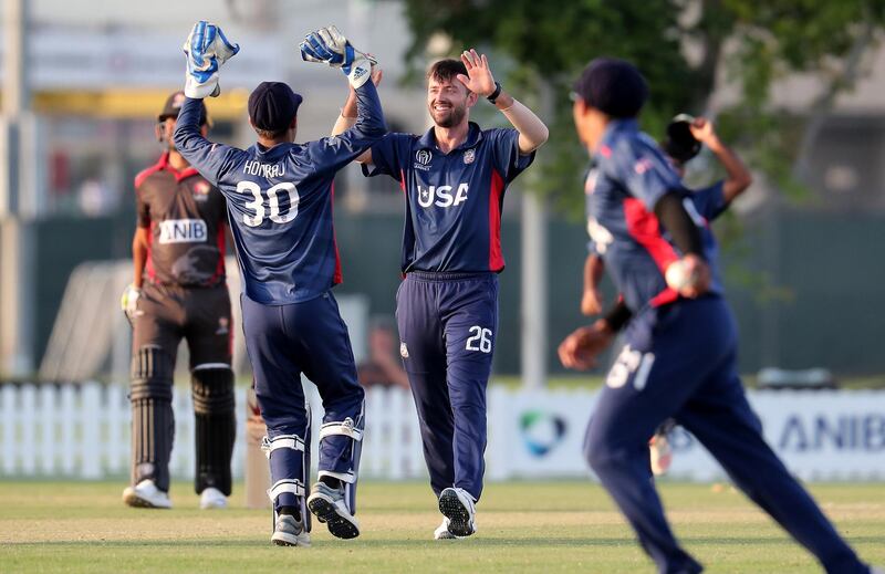 DUBAI, UNITED ARAB EMIRATES , Dec 12– 2019 :- :- Ian Holland of USA (center) celebrating after taking the wicket of Zahoor Khan during the World Cup League 2 cricket match between UAE vs USA held at ICC academy in Dubai. USA won the match by 98 runs. He took 3 wickets in this match. ( Pawan Singh / The National )  For Sports. Story by Paul
