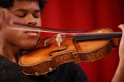 Violinist Braimah Kanneh-Mason plays the rare 'Hellier' violin, created by Italian luthier Antonio Stradivari in 1679. Reuters