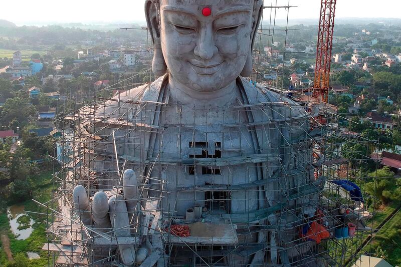 A giant under-construction Buddha statue at Khai Nguyen pagoda in Son Tay on the outskirts of Hanoi on the eve of Vesak day or Buddha day festival, marking the birth of Gautama Buddha, his attaining enlightenment, and his passing away.  AFP