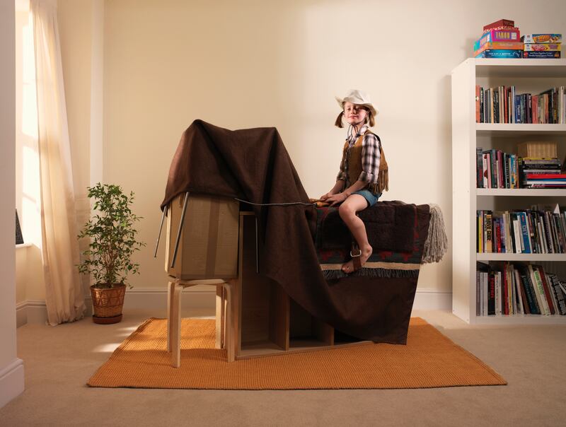 Encourage children to let their imagination run free when playing dress-up or rearranging furniture to create fun props. Getty Images