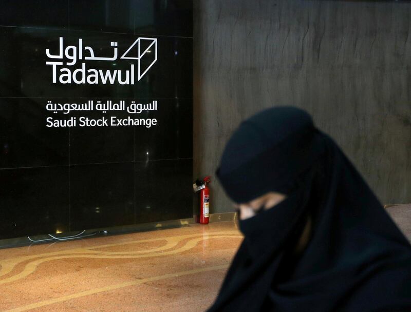 FILE PHOTO: A Saudi woman walks at the Saudi stock market (Tadawul), in Riyadh, Saudi Arabia March 9, 2020.  REUTERS/Ahmed Yosri/File Photo